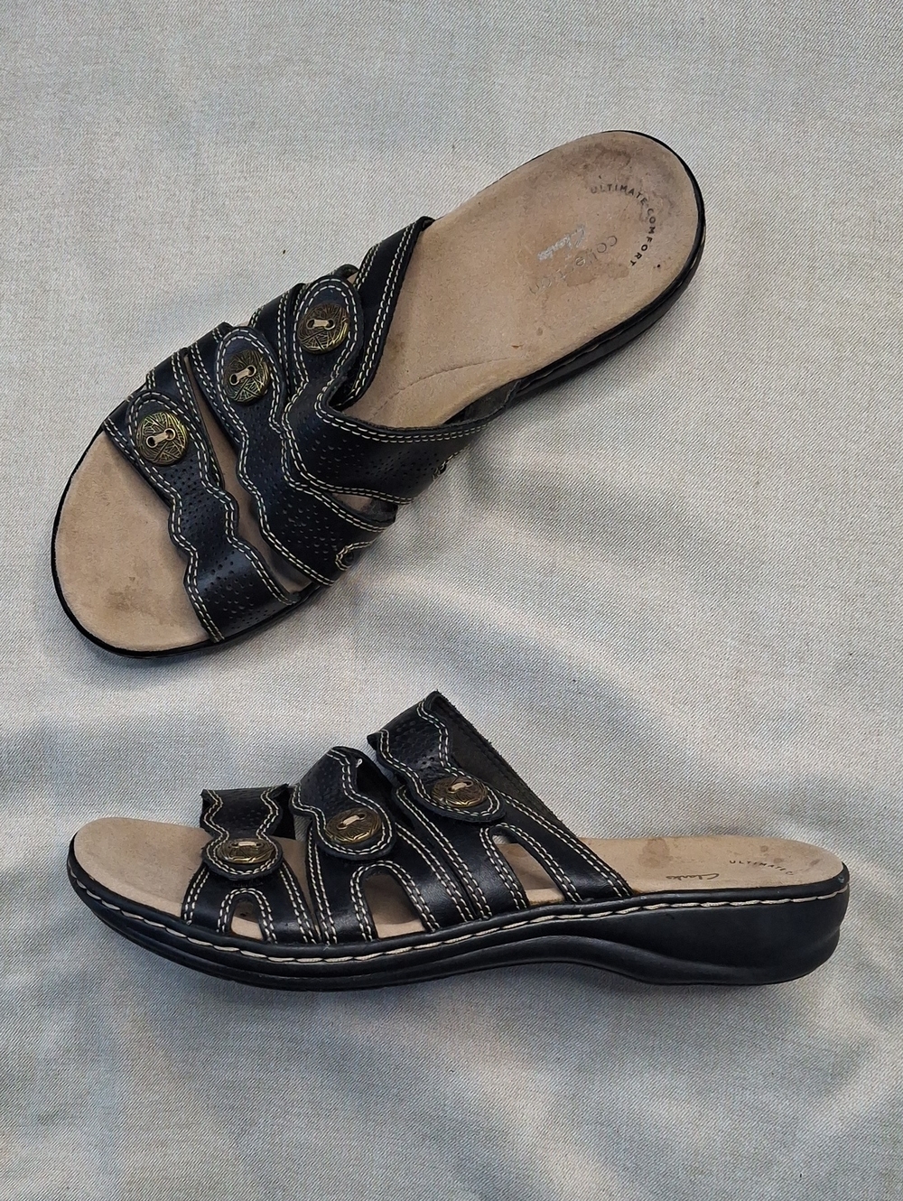 Clarks Black and Beige Slip-On Mules with Decorative Buttons